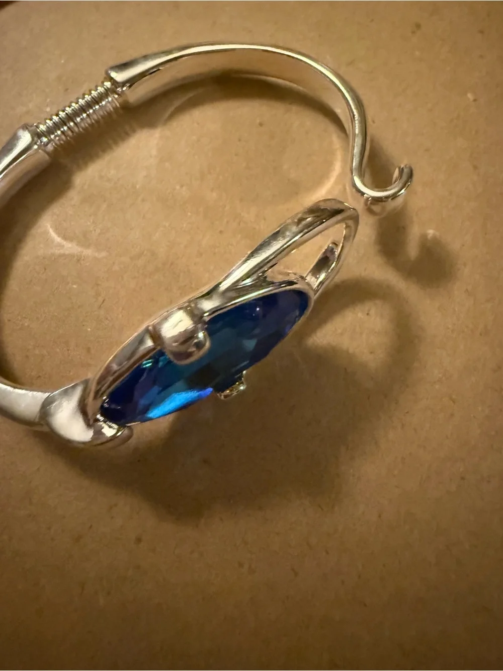 Uno de 50 bangle bracelet with faceted blue crystal